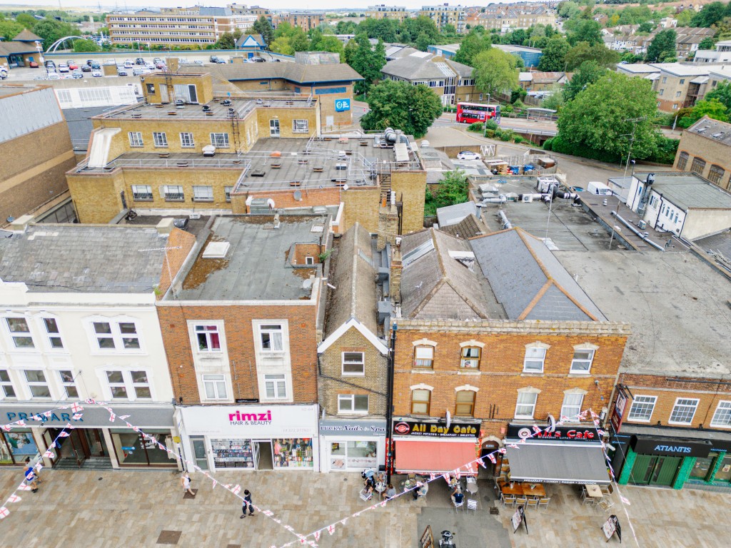 Lot: 91 - MAISONETTE IN HIGH STREET - External image of high level shot of front above shops